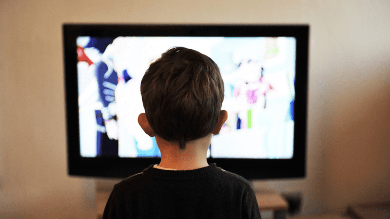 kid watching smart tv